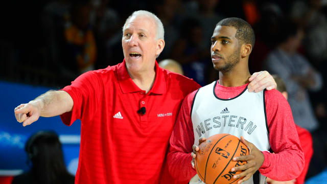 Feb 16, 2013; Houston, TX, USA; Western Conference head coach Gregg Popovich of the San Antonio Spurs talks with guard Chris Paul (3) of the Los Angeles Clippers during practice for the 2013 NBA All-Star game at the George R. Brown Convention Center.